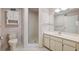 Well-lit bathroom features a tiled shower, updated vanity and ample storage at 2192 Swedish Dr # 26, Clearwater, FL 33763