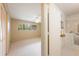 Bedroom featuring a view into the en-suite bathroom with a walk-in tub and shower at 2192 Swedish Dr # 26, Clearwater, FL 33763