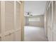 Bright bedroom featuring neutral walls, carpet, ceiling fan and a large closet at 2192 Swedish Dr # 26, Clearwater, FL 33763