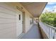 Hallway view showing unit number 26 and a partial landscaped view at 2192 Swedish Dr # 26, Clearwater, FL 33763