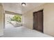 Hallway view showing elevator access with views of a walkway overlooking a landscaped view at 2192 Swedish Dr # 26, Clearwater, FL 33763