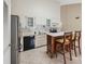 Charming eat-in kitchen with stainless steel appliances and island at 2192 Swedish Dr # 26, Clearwater, FL 33763