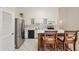 Well-lit kitchen with white cabinetry and stainless steel refrigerator at 2192 Swedish Dr # 26, Clearwater, FL 33763