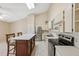 Bright kitchen boasts stainless steel appliances, white cabinets, and central island with seating at 2192 Swedish Dr # 26, Clearwater, FL 33763