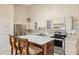 Bright kitchen featuring stainless steel oven and marble topped island at 2192 Swedish Dr # 26, Clearwater, FL 33763
