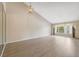 Bright living room featuring vaulted ceilings, modern light fixture and large windows at 2192 Swedish Dr # 26, Clearwater, FL 33763