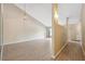Spacious living room featuring laminate floors, natural light, and view of the entryway at 2192 Swedish Dr # 26, Clearwater, FL 33763