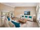 Living room featuring neutral walls, modern furniture, and view of the dining area at 2192 Swedish Dr # 26, Clearwater, FL 33763