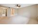 Spacious main bedroom featuring ensuite bathroom, ceiling fan, and plenty of room at 2192 Swedish Dr # 26, Clearwater, FL 33763