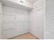 Spacious walk-in closet with ample storage provided by the installed wire shelving at 2192 Swedish Dr # 26, Clearwater, FL 33763