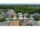 Aerial view of a residential street showcasing the home's location within a lush, green neighborhood at 25435 Bruford Blvd, Land O Lakes, FL 34639