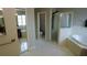 View of a bright bathroom with separate shower and tub, toilet, and tile flooring at 25435 Bruford Blvd, Land O Lakes, FL 34639