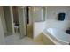 Bathroom featuring a sleek shower and soaking tub at 25435 Bruford Blvd, Land O Lakes, FL 34639