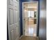 Hallway view into a bathroom with a tub and shower at 25435 Bruford Blvd, Land O Lakes, FL 34639