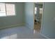 Bedroom with tile flooring, natural light, and view of adjacent bathroom at 25435 Bruford Blvd, Land O Lakes, FL 34639