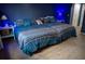 Bedroom with a king-sized bed and matching lamps at 25435 Bruford Blvd, Land O Lakes, FL 34639