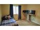 Bedroom with large window, desk, and comfortable bed for relaxing or working at 25435 Bruford Blvd, Land O Lakes, FL 34639