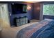 Bedroom with a king-sized bed, TV and large window at 25435 Bruford Blvd, Land O Lakes, FL 34639