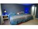 Bedroom with a king-sized bed and matching lamps at 25435 Bruford Blvd, Land O Lakes, FL 34639