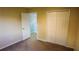 Bedroom features carpet flooring, a closet, and neutral walls at 25435 Bruford Blvd, Land O Lakes, FL 34639