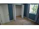 Cozy carpeted bedroom with a bright window and a closet at 25435 Bruford Blvd, Land O Lakes, FL 34639