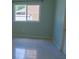 Bedroom with tile flooring, natural light, and neutral paint at 25435 Bruford Blvd, Land O Lakes, FL 34639