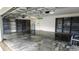 Large garage with shelving, finished floor, and a door to the interior at 25435 Bruford Blvd, Land O Lakes, FL 34639