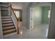 View of staircase leading to upper level, showing entry to other rooms at 25435 Bruford Blvd, Land O Lakes, FL 34639