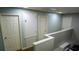 Upstairs hallway with carpet and multiple doors at 25435 Bruford Blvd, Land O Lakes, FL 34639