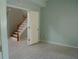 View of staircase leading to upper level, showing entry to room at 25435 Bruford Blvd, Land O Lakes, FL 34639
