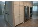 Bright kitchen featuring white cabinets, stainless steel appliances, and built-in ovens at 25435 Bruford Blvd, Land O Lakes, FL 34639