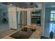 A stainless steel refrigerator and oven are in the kitchen with white cabinets and a butcher block island at 25435 Bruford Blvd, Land O Lakes, FL 34639