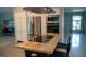 A kitchen featuring stainless steel appliances, white cabinets, and butcher block island with seating at 25435 Bruford Blvd, Land O Lakes, FL 34639