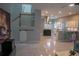 Stylish open-concept living space with kitchen, stairs, and modern barn door at 25435 Bruford Blvd, Land O Lakes, FL 34639