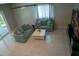 Bright living room with comfortable seating, fireplace display and neutral tones at 25435 Bruford Blvd, Land O Lakes, FL 34639