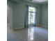 Bright living room with tile flooring, large window, and neutral wall color at 25435 Bruford Blvd, Land O Lakes, FL 34639