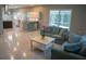 Open concept living area with pool view, seamlessly connecting to the kitchen at 25435 Bruford Blvd, Land O Lakes, FL 34639