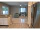 Living space open to kitchen with breakfast bar and stainless steel appliances at 25435 Bruford Blvd, Land O Lakes, FL 34639