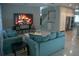 Bright living room with fireplace display, open to kitchen and staircase at 25435 Bruford Blvd, Land O Lakes, FL 34639