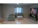 Cozy living room features neutral decor, comfortable seating, and fireplace display at 25435 Bruford Blvd, Land O Lakes, FL 34639