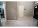 Mud room with tile flooring, a laundry area, and access to the front entrance at 25435 Bruford Blvd, Land O Lakes, FL 34639