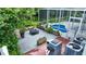 Enclosed screened pool area with wooden deck, wooden planter boxes and seating at 25435 Bruford Blvd, Land O Lakes, FL 34639