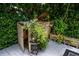 Wooden deck with outdoor kitchen, wooden planters, and wooden storage bin at 25435 Bruford Blvd, Land O Lakes, FL 34639