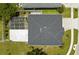 Aerial shot of home with enclosed patio, solar panels and a well-maintained roof at 2746 Heathgate Way, Land O Lakes, FL 34638