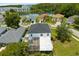 Aerial view of the home, patio, and the surrounding neighborhood with a pond at 2746 Heathgate Way, Land O Lakes, FL 34638