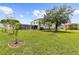 Expansive backyard with mature trees provides ample space for recreation at 2746 Heathgate Way, Land O Lakes, FL 34638