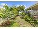 Lush backyard with privacy fence and tropical plants offers great ambiance at 2746 Heathgate Way, Land O Lakes, FL 34638