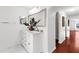 Bathroom featuring double vanity, marble flooring, framed mirrors, and modern fixtures at 2746 Heathgate Way, Land O Lakes, FL 34638
