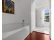 Soaking tub featuring wall art, with a window and white marble flooring bringing in natural light at 2746 Heathgate Way, Land O Lakes, FL 34638