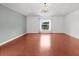 Comfortable bedroom with wood floors, a decorative chandelier, and great natural light at 2746 Heathgate Way, Land O Lakes, FL 34638